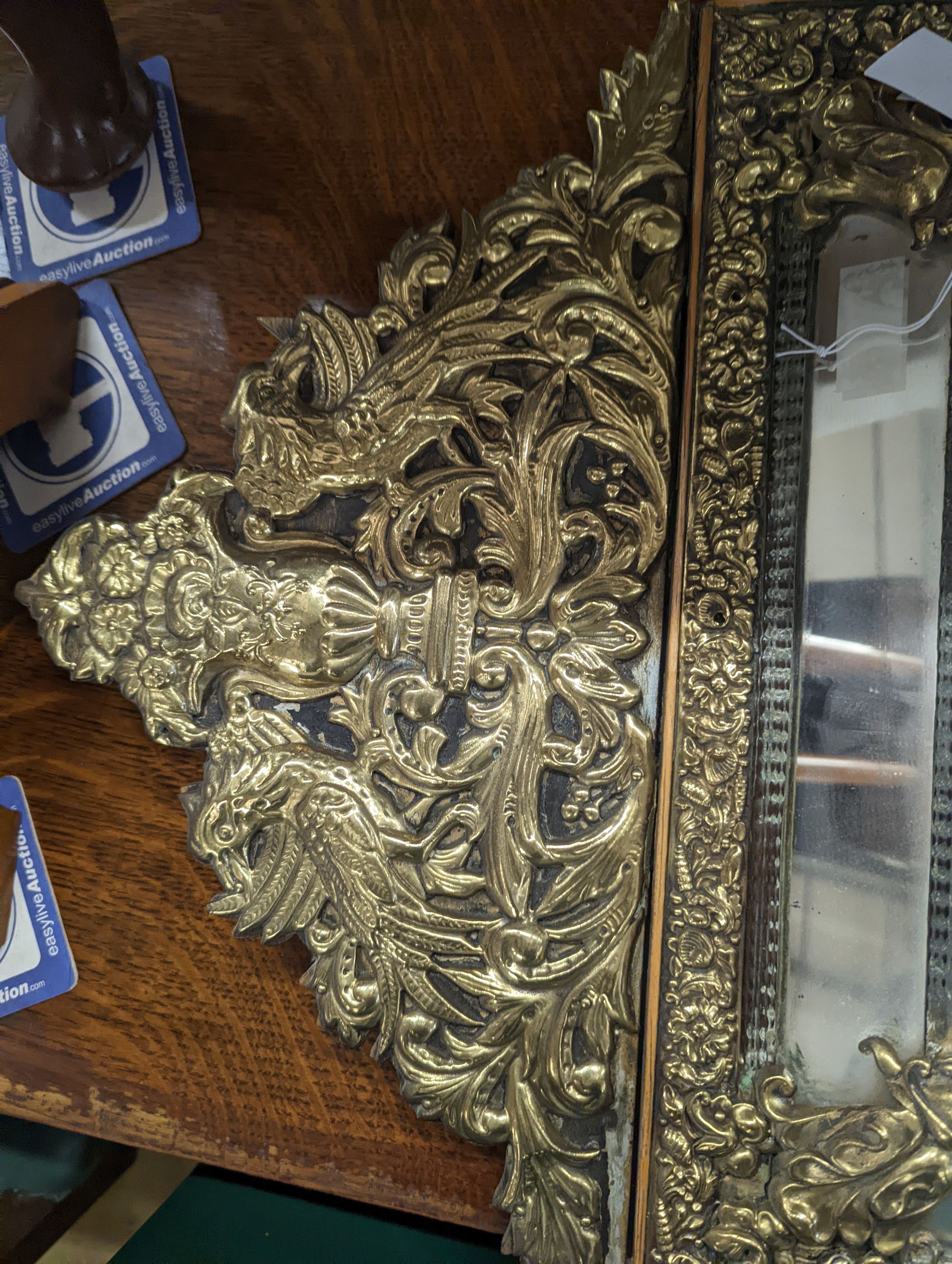 A 19th century Dutch embossed brass wall mirror, width 45cm, height 75cm